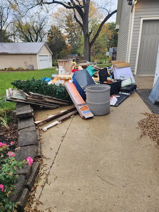 Dumpster being loaded with debris for Residential Dumpster Rental in Tehachapi